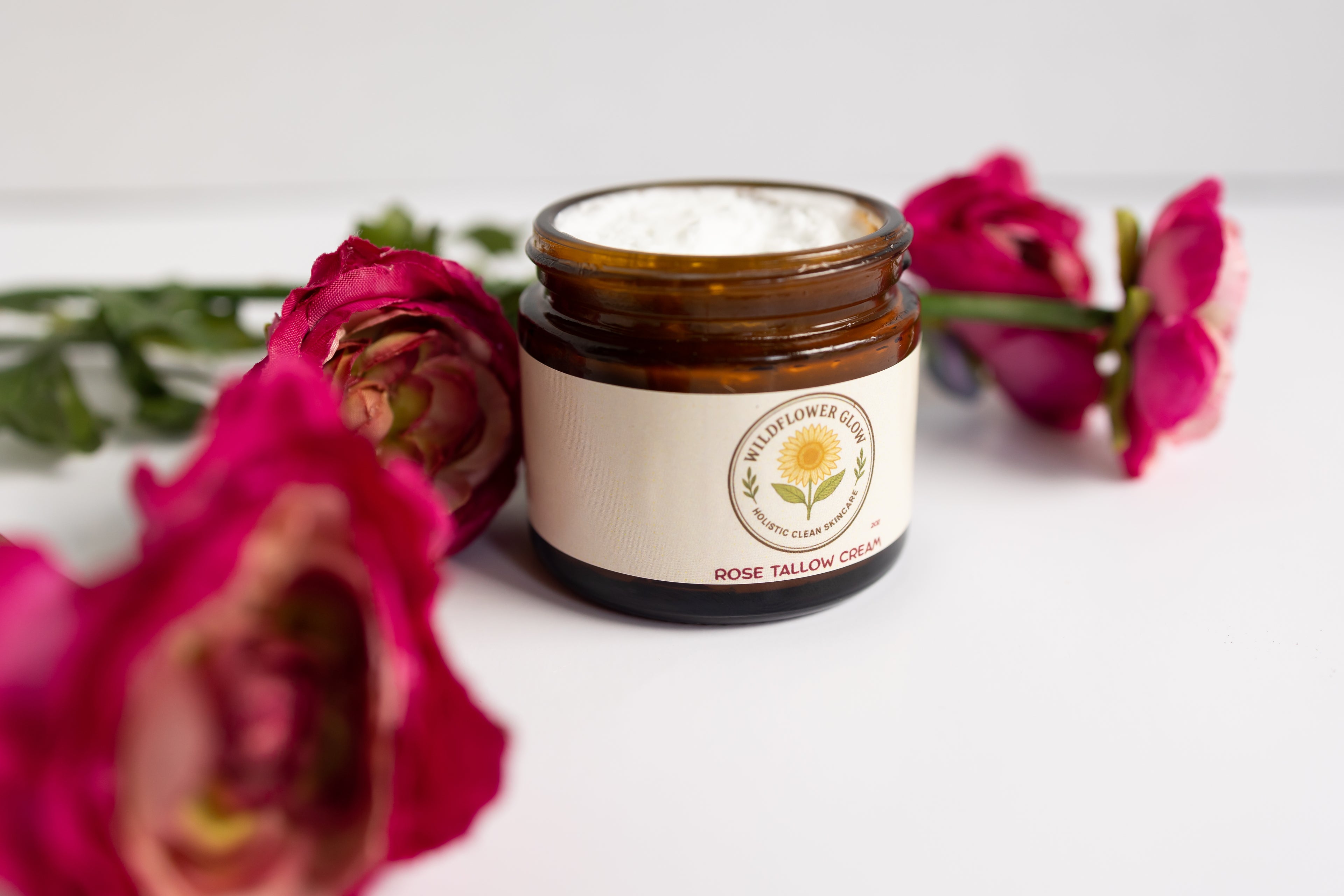 Jar of cream on a white background with pink roses