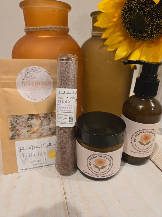 Lavender lemon bath salts and sugar scrub next to a lavender tallow cream and facial cleanser. 